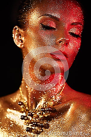 Portrait of beautiful woman with sparkles on her face Stock Photo