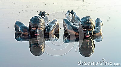 Portrait of a beautiful woman taking mud bath Editorial Stock Photo