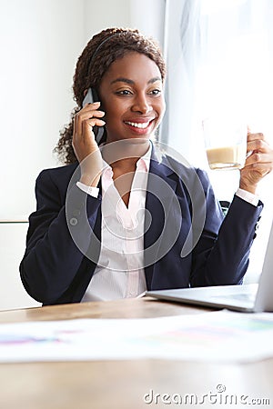 African american businesswoman in office making a phone call Stock Photo