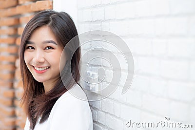 Portrait of beautiful young asian woman happiness standing on gr Stock Photo