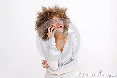 Beautiful young black woman talking on cellphone against whit background Stock Photo