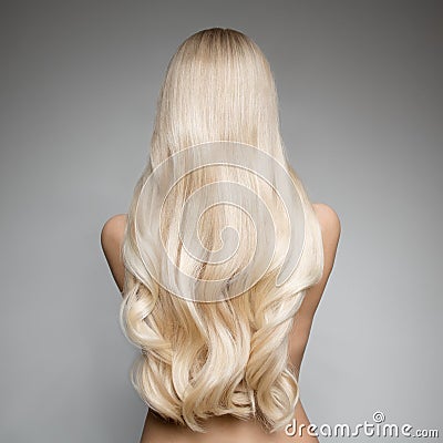 Portrait Of A Beautiful Young Blond Woman With Long Wavy Hair. Stock Photo