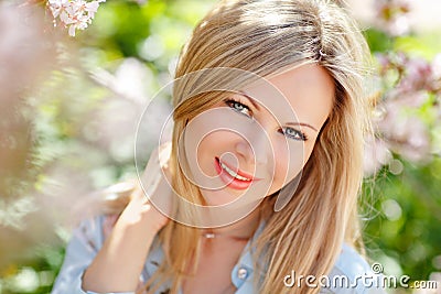 Portrait of a beautiful young blonde woman with long hair in a b Stock Photo