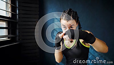 Portrait beautiful young boxing woman training punching in gym free space, copyspace Stock Photo