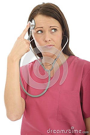Portrait Of A Beautiful Young Curious Female Doctor Acting Silly with a Stethoscope Stock Photo