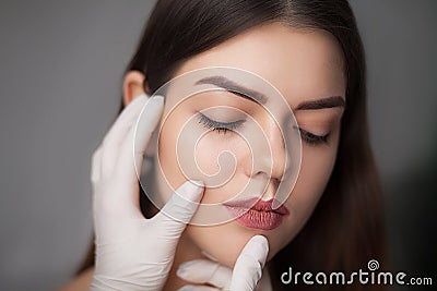 Portrait of beautiful young female face with beauty treatment Stock Photo