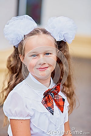Portrait of beautiful young first grader Farewell Bell. day of knowledge. beginning of the school year Stock Photo