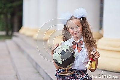 Portrait of beautiful young first-grader Farewell Bell. day of knowledge. beginning of the school year. school equipment. Young Stock Photo