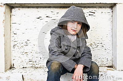 Portrait of a beautiful young girl in winter coat and jeans. Stock Photo