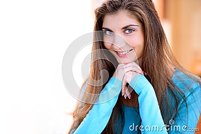 Portrait of a beautiful young lady in the kitchen at home and smiling Stock Photo