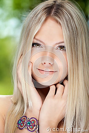 Portrait of a beautiful young smiling woman Stock Photo