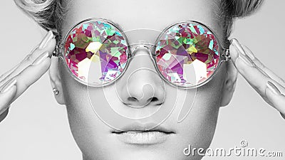 Portrait of beautiful young woman with colored glasses Stock Photo