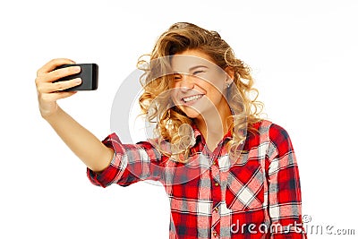 Portrait of a beautiful young woman making selfie on smart phone Stock Photo
