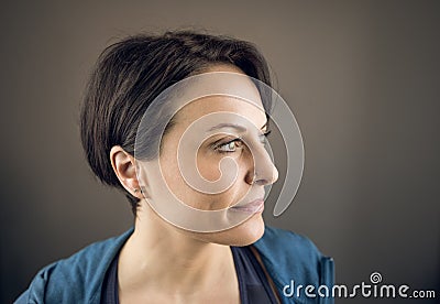 Portrait of a beautiful young woman in profile smiling Stock Photo