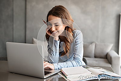 Portrait of a beautiful young woman studying Stock Photo