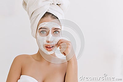 Portrait of beautiful young woman with towels after take bath make cosmetic mask and worries about her skin Stock Photo