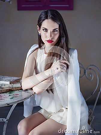 Portrait of a beautiful young woman wearing white shorts and jacket Stock Photo