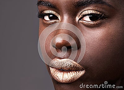 Portrait, beauty and closeup for cosmetic, black woman person and lipstick on grey background. Face, gold and eyeshadow Stock Photo