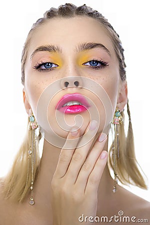 Portrait of beauty model with yellow creative makeup and vivid pink glossy lips, isolated on white. Beautiful young woman with Stock Photo