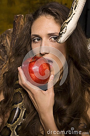 Portrait of beauty young lady with snake and red apple Stock Photo