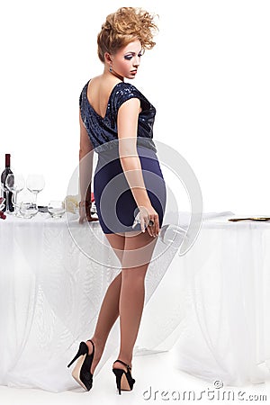 Portrait of beutiful woman standing nea table Stock Photo