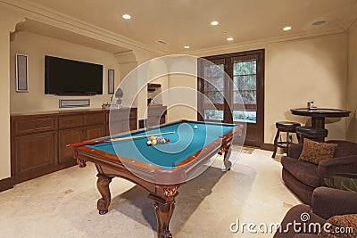 Billiards table in games room Stock Photo