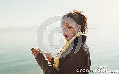 Portrait of biracial girl near water Stock Photo