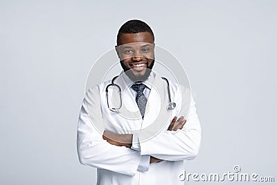 Portrait of black male doctor with stethoscope on white background Stock Photo