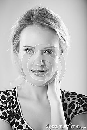 Portrait in black and white of woman in leopard print shirt Stock Photo