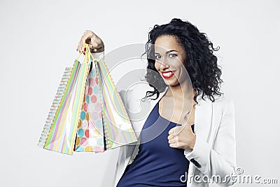 Portrait of black woman happy with perfect shopping paper bags, smiling face Stock Photo