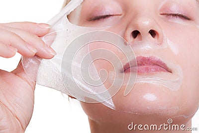 Portrait blond girl in facial mask. Beauty and skin care. Stock Photo