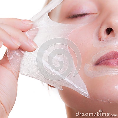 Portrait blond girl in facial mask. Part face. Beauty and skin care. Stock Photo