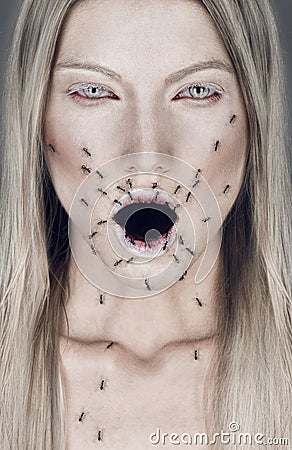 Portrait of blond woman with open mouth and ants Stock Photo