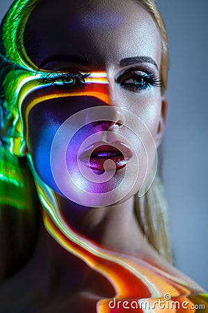 Portrait of blond Woman with shining lights on face Stock Photo