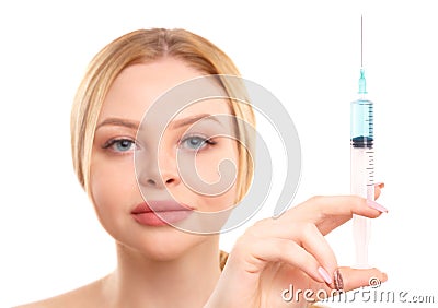 Portrait of a blonde woman isolated on white background, with a syringe in her hands, concept of medicine, plastic Stock Photo