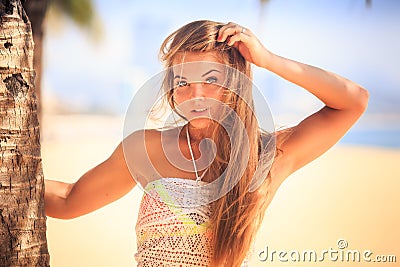 portrait of blonde grey-eyed girl in lace touching long hair Stock Photo