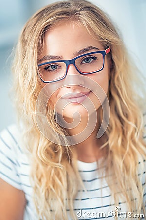 Portrait of blonde young woman with glasses Stock Photo
