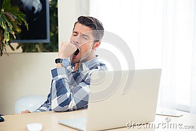 Portrait of a bored man yawning Stock Photo