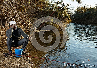 Portrait of bored waiting fisherman Stock Photo