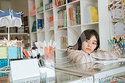 Portrait boring young girl entrepreneur waiting customer Stock Photo