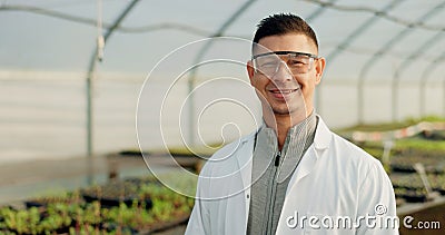 Portrait, botanist and happy man at greenhouse for science farm organic vegetables, plant or growth for ecology. Face Stock Photo