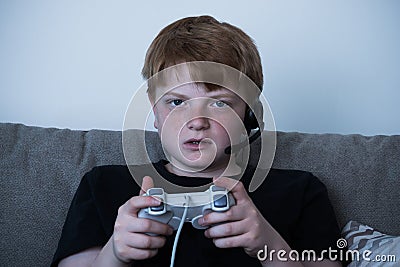 Boy With A Joystick Playing Videogames Stock Photo