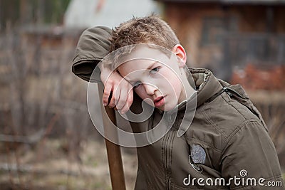 Portrait of boy tired after work Stock Photo