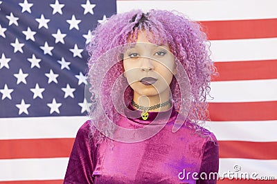 Portrait of a brave afro american woman against a flag of the Un Stock Photo