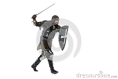 Portrait of brave medieval warrior, knight in special coat of mail attaching with sword isolated over white studio Stock Photo
