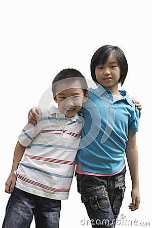 Portrait of brother and sister standing against white background Stock Photo