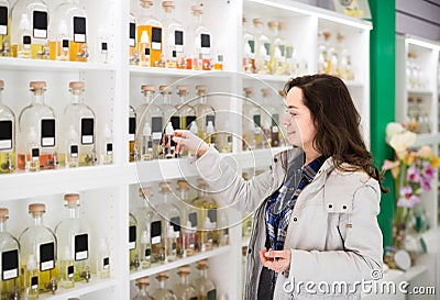 Portrait of brunette shopping in perfume store Stock Photo