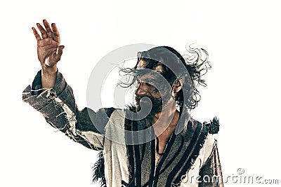 Portrait of a brutal bald-headed viking in a battle posing against a white background. Stock Photo