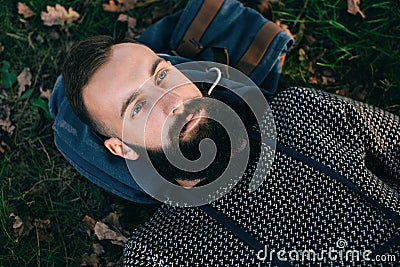 Portrait brutal bearded hipster dreamer man in the forest Stock Photo