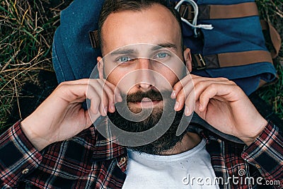 Portrait brutal bearded hipster man in the forest Stock Photo